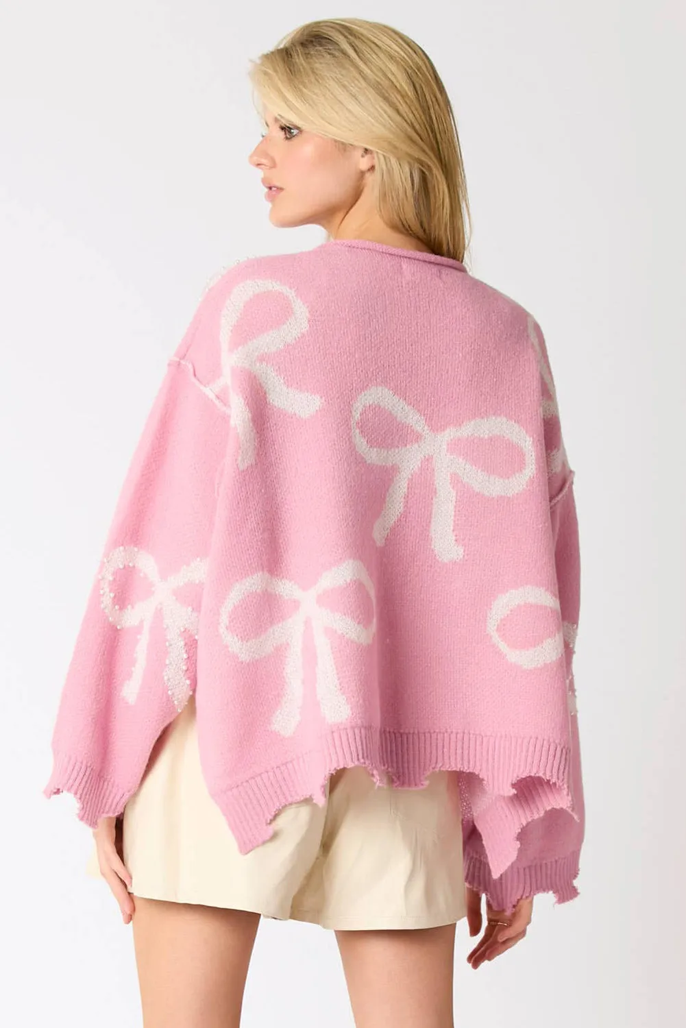KaleaBoutique Pearl Beaded Bowknot Pattern Distressed Split Hem Sweater