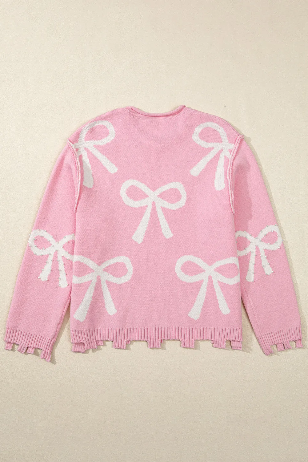 KaleaBoutique Pearl Beaded Bowknot Pattern Distressed Split Hem Sweater