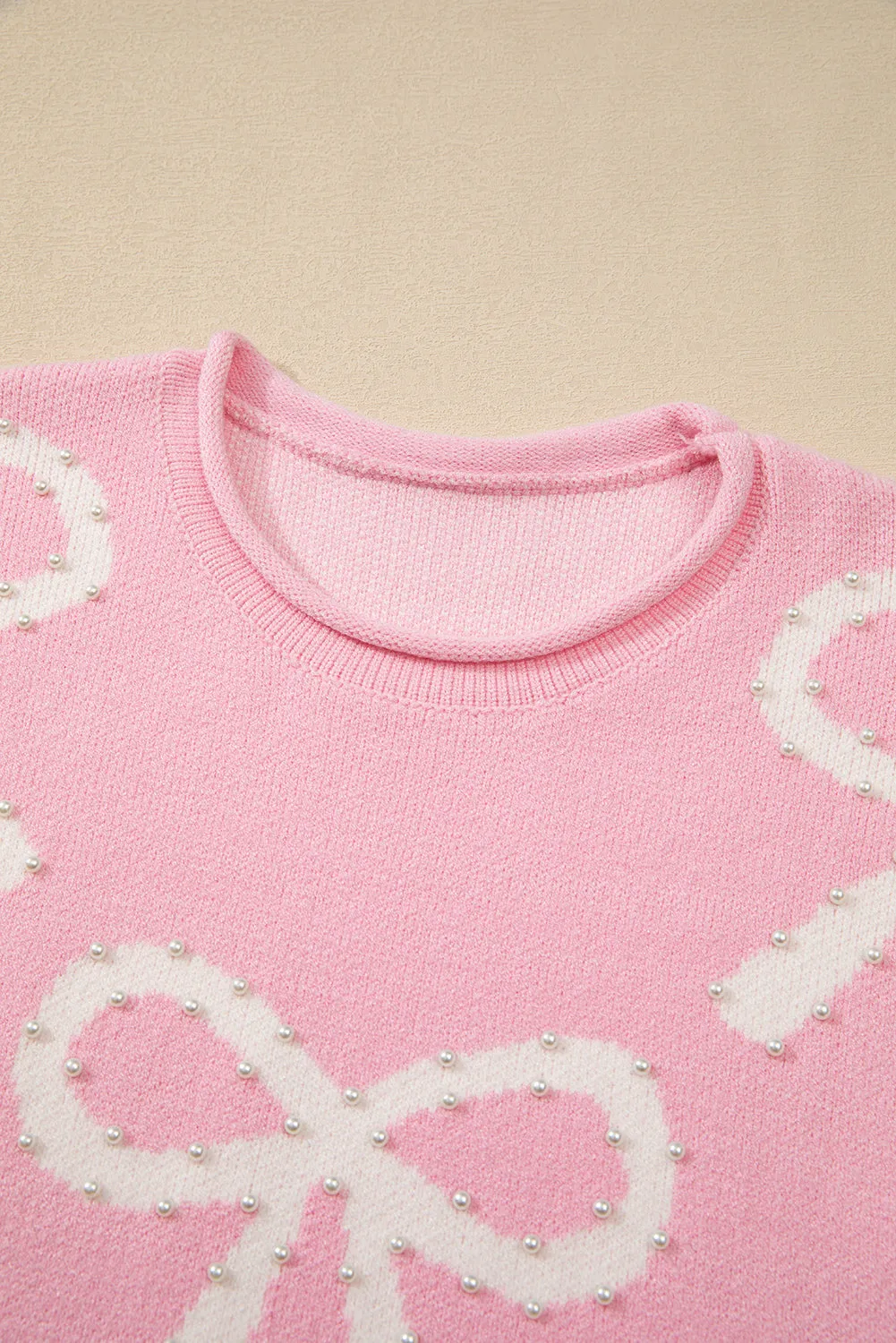 KaleaBoutique Pearl Beaded Bowknot Pattern Distressed Split Hem Sweater