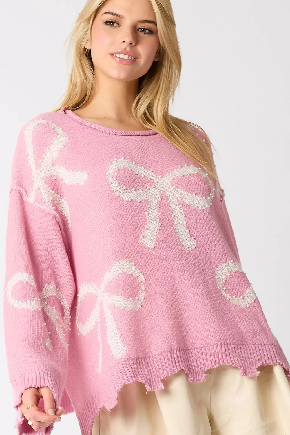 KaleaBoutique Pearl Beaded Bowknot Pattern Distressed Split Hem Sweater