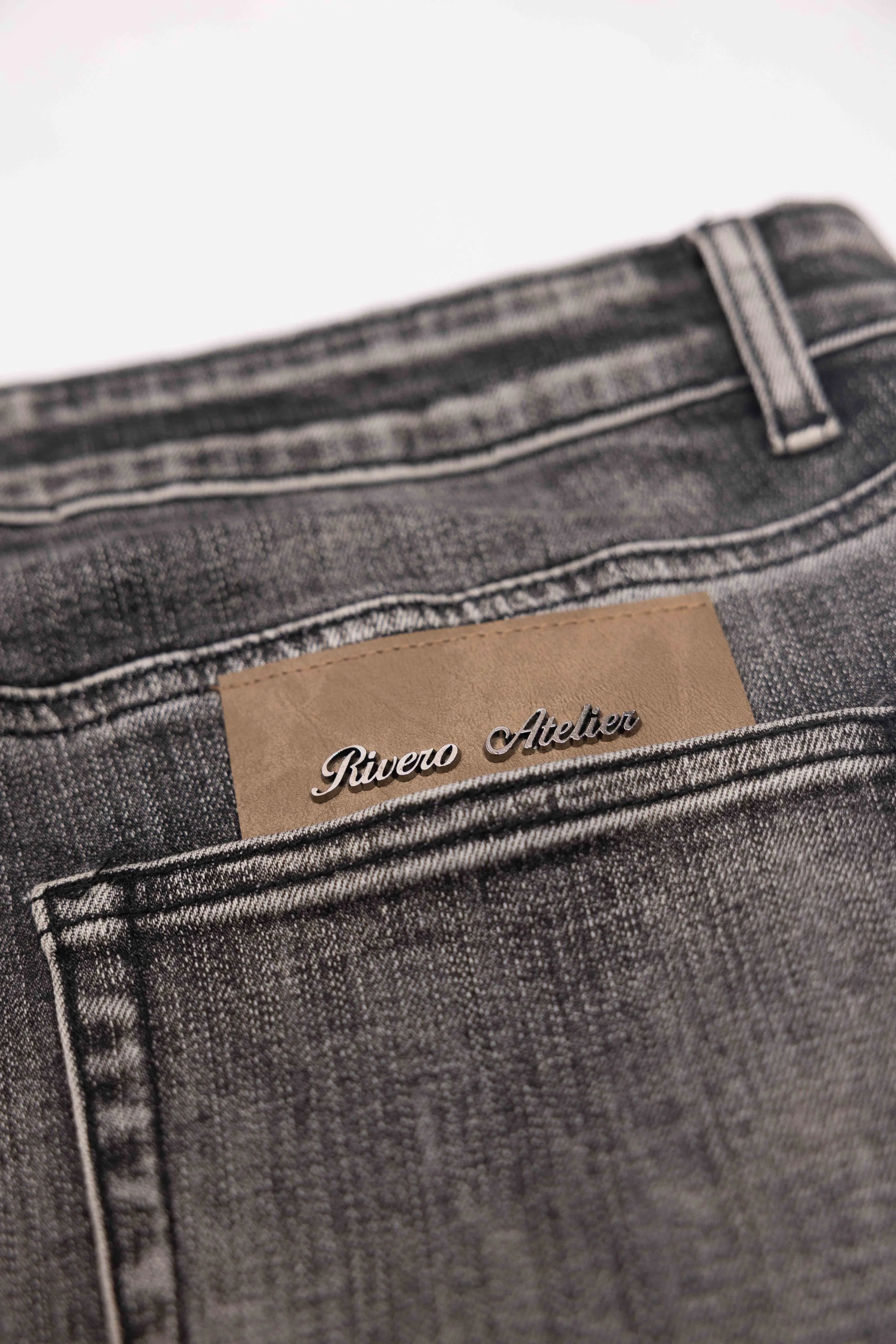 RELAXED FADED FOLD DENIM JEANS