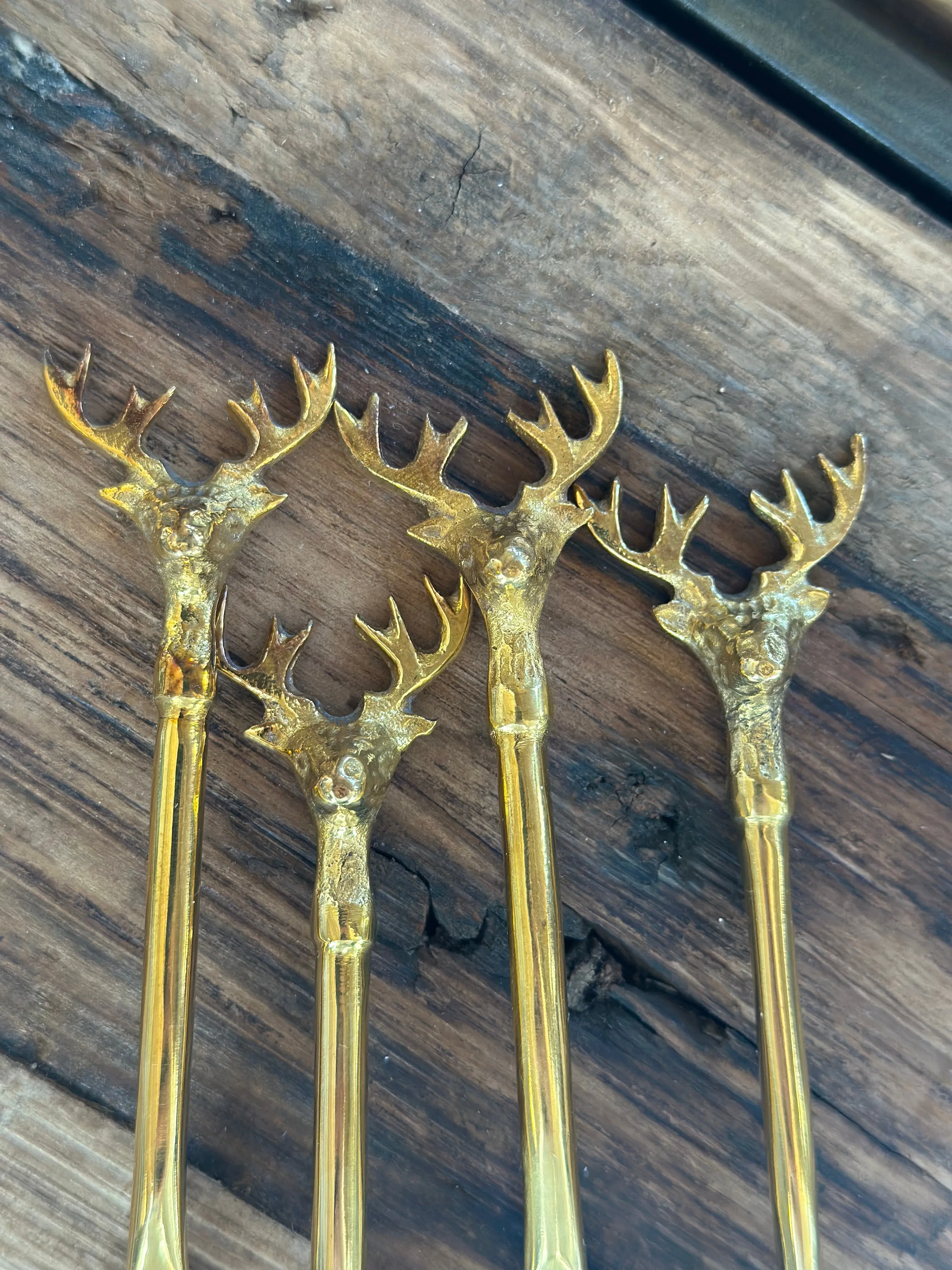 Stainless Steel and brass spoons, set of 4 with reindeer tops
